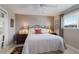 Bedroom features a comfortable bed, bedside tables, and natural light at 606 Emerald Ln, Holmes Beach, FL 34217