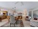 Open concept living and dining area, showing the flow into the kitchen and natural lighting at 606 Emerald Ln, Holmes Beach, FL 34217
