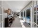 Hallway with natural light, a view of the pool, and access to the rooms at 606 Emerald Ln, Holmes Beach, FL 34217