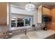 Kitchen with a view of the canal featuring an outdoor dining area and lush landscaping at 606 Emerald Ln, Holmes Beach, FL 34217