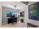 Bright office with a piano and large windows overlooking the canal at 606 Emerald Ln, Holmes Beach, FL 34217