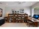 Dedicated office space featuring built-in wooden bookshelves and a work desk at 606 Emerald Ln, Holmes Beach, FL 34217