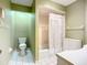 Clean bathroom featuring a shower-tub combo and functional layout at 6102 Penny Ln, Bradenton, FL 34207