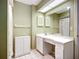 Bathroom with a vanity and cabinets for ample storage at 6102 Penny Ln, Bradenton, FL 34207