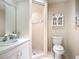 Well-lit bathroom showcasing walk-in shower and sleek white vanity at 6102 Penny Ln, Bradenton, FL 34207