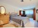 Bedroom featuring neutral walls, bright carpets, and organized study space at 6102 Penny Ln, Bradenton, FL 34207