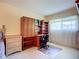Bright bedroom with dedicated study area, including carpet floors and natural light at 6102 Penny Ln, Bradenton, FL 34207