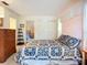 Charming bedroom with wood furniture and view to an attached space at 6102 Penny Ln, Bradenton, FL 34207