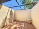 Private courtyard with tiled flooring, providing a tranquil outdoor space at 6102 Penny Ln, Bradenton, FL 34207
