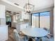 Dining area with a sliding glass door that leads to a private courtyard at 6102 Penny Ln, Bradenton, FL 34207