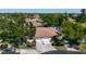 Aerial shot showing a neighborhood with mature trees, landscaping, and well-kept homes at 6102 Penny Ln, Bradenton, FL 34207