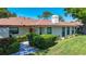 Charming single-story home features a well-maintained lawn, mature landscaping, and a welcoming facade at 6102 Penny Ln, Bradenton, FL 34207