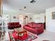 Spacious living room featuring bright carpets, lots of natural light, and comfortable furniture at 6102 Penny Ln, Bradenton, FL 34207