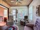 Comfortable sunroom with three recliners for relaxation and enjoyment at 6102 Penny Ln, Bradenton, FL 34207