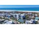 Stunning aerial view of condo building with beach views and a tennis court for recreation and leisure at 625 Beach Rd # 207, Sarasota, FL 34242