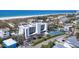 Bird's eye view of the condo, highlighting its tennis courts, parking area, and close proximity to the beach at 625 Beach Rd # 207, Sarasota, FL 34242