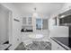 Sunlit breakfast nook with a charming table set and delightful decor at 625 Beach Rd # 207, Sarasota, FL 34242