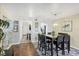 Elegant dining room with a glass-top table and stylish seating at 625 Beach Rd # 207, Sarasota, FL 34242