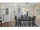Elegant dining area with stylish seating and modern lighting fixture at 625 Beach Rd # 207, Sarasota, FL 34242