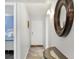 Inviting entryway featuring tile floors, decor, and a glimpse of the main bedroom at 625 Beach Rd # 207, Sarasota, FL 34242