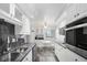 Modern kitchen with granite countertops, stainless steel appliances, and charming breakfast nook at 625 Beach Rd # 207, Sarasota, FL 34242