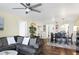Open concept living and dining area, features hardwood floors, ocean view, and modern furnishings at 625 Beach Rd # 207, Sarasota, FL 34242