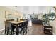 Open concept living area with dining space and sliding glass doors to the outside at 625 Beach Rd # 207, Sarasota, FL 34242