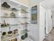 Display cabinet showcases decor, adding elegance to the living space at 625 Beach Rd # 207, Sarasota, FL 34242