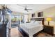Bright main bedroom featuring a private balcony with ocean views at 625 Beach Rd # 207, Sarasota, FL 34242