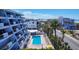 Inviting condo complex pool with beach views and an array of lounge chairs for relaxing by the water at 625 Beach Rd # 207, Sarasota, FL 34242