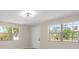 Bright bedroom features two big windows and updated floors at 6732 Washington Pl, Bradenton, FL 34207