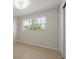 Bedroom with a sliding door closet, tile floors, and natural light at 6732 Washington Pl, Bradenton, FL 34207