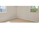 Cozy bedroom with tile floors and two windows offering natural light at 6732 Washington Pl, Bradenton, FL 34207