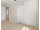 Bedroom featuring sliding closet doors and tile floors for easy maintenance at 6732 Washington Pl, Bradenton, FL 34207