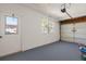 Spacious garage interior with door to outside, window, and garage door at 6732 Washington Pl, Bradenton, FL 34207