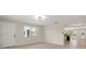 Bright living room with big windows and a white front door at 6732 Washington Pl, Bradenton, FL 34207