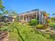 Expansive backyard showcases a screened-in lanai, an additional screened enclosure, and manicured landscaping at 6748 Hickory Hammock Cir, Bradenton, FL 34202