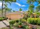 Well-kept property featuring a verdant lawn, mature plantings, and manicured landscaping adding character to the home at 6748 Hickory Hammock Cir, Bradenton, FL 34202