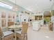 Bright kitchen with white cabinets and breakfast nook, perfect for casual dining at 6748 Hickory Hammock Cir, Bradenton, FL 34202