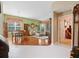 Open-concept living area featuring hardwood floors and views to the outdoor patio at 6748 Hickory Hammock Cir, Bradenton, FL 34202