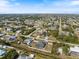 Expansive aerial view of a residential community with numerous houses and lush landscaping at 7145 Mamouth St, Englewood, FL 34224