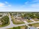 A quiet residential street lined with well-maintained homes and verdant landscaping at 7145 Mamouth St, Englewood, FL 34224