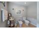 Charming bathroom with unique fixtures including a bidet and a washstand with a pitcher at 7145 Mamouth St, Englewood, FL 34224