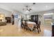 Spacious dining room with a view of the lanai through sliding glass doors and large windows at 7145 Mamouth St, Englewood, FL 34224