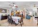 Open concept dining area with tile floors and views to the kitchen at 7145 Mamouth St, Englewood, FL 34224