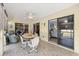 Inviting Florida room with tiled flooring, and sliding glass doors for seamless indoor-outdoor living at 7145 Mamouth St, Englewood, FL 34224