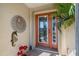 Close-up of an inviting front door with decorative elements, enhancing curb appeal at 7145 Mamouth St, Englewood, FL 34224