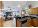 Open floor plan with the kitchen overlooking the dining room and lanai at 7145 Mamouth St, Englewood, FL 34224