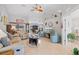 Bright and open living room with vaulted ceiling, showcasing the home's inviting atmosphere at 7145 Mamouth St, Englewood, FL 34224