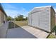 Durable outdoor shed on a concrete foundation, perfect for storage with clear blue skies at 7145 Mamouth St, Englewood, FL 34224